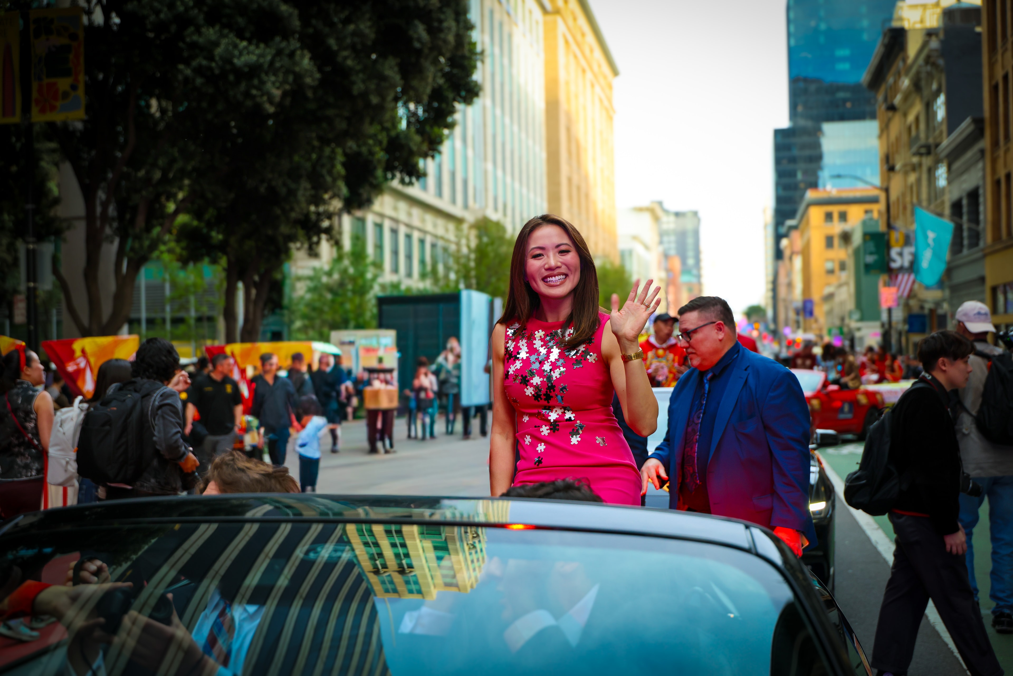 Woman in Red Waving from Car