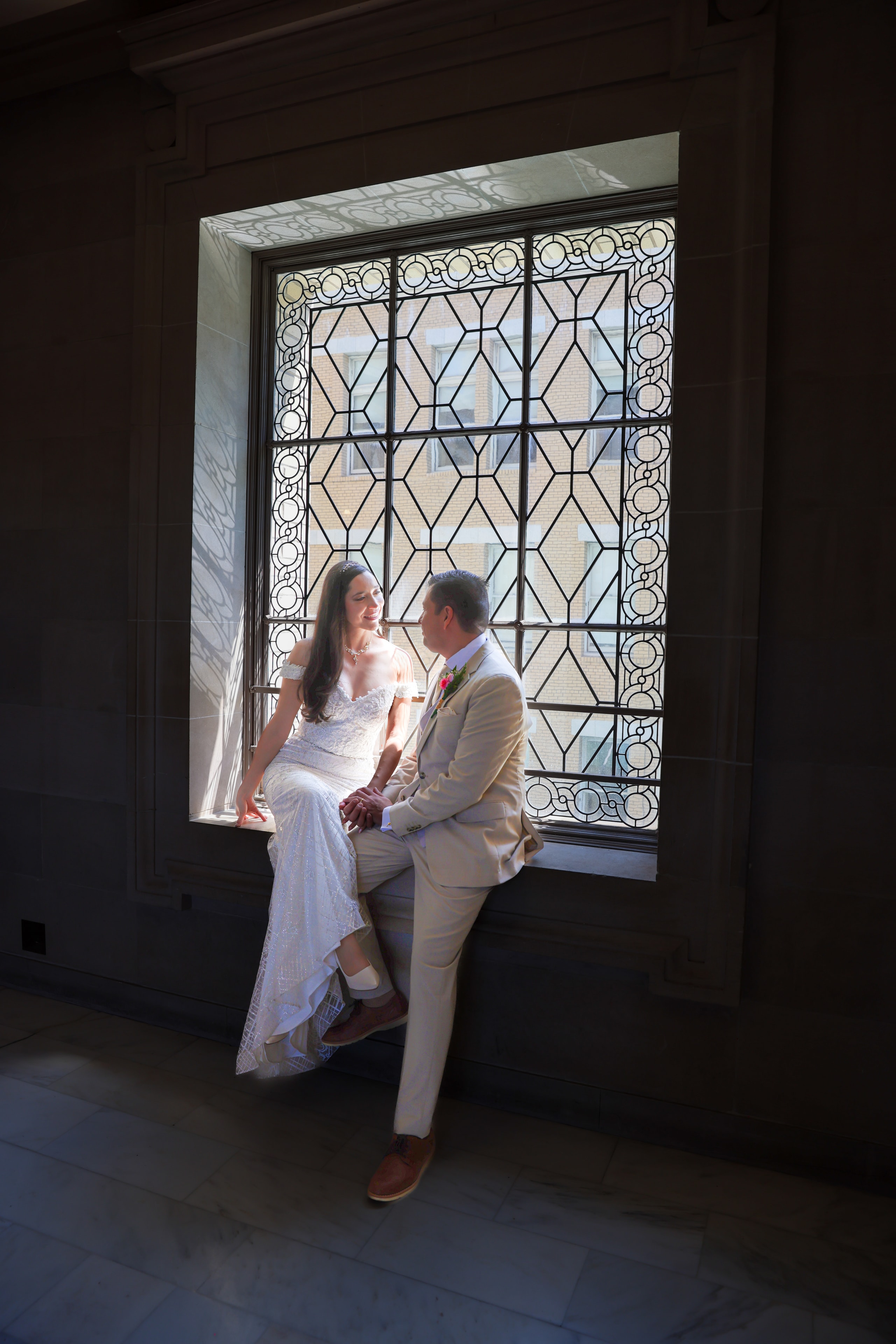 Couple at the Ornate Window